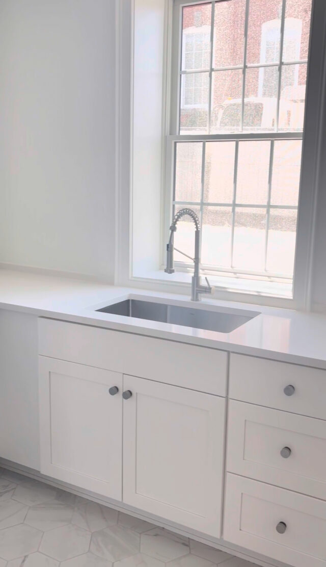 In the lower level in this Marblehead home, natural light carries throughout the space, brightening all three bedrooms and creating an open, airy feel. Two full bathrooms feature custom millwork and oversized mirrors, while a thoughtfully designed laundry and drying room is complete with its own utility sink. 

#AnySeasonDesignBuild #MarbleheadMA #BasementDesign #CustomShelving #BuiltWithIntent #NaturalLightDesign #SunlitInteriors #BrightSpaces